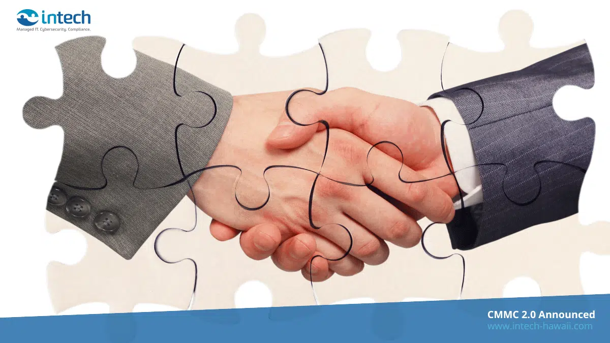 shaking hands inside puzzle pieces