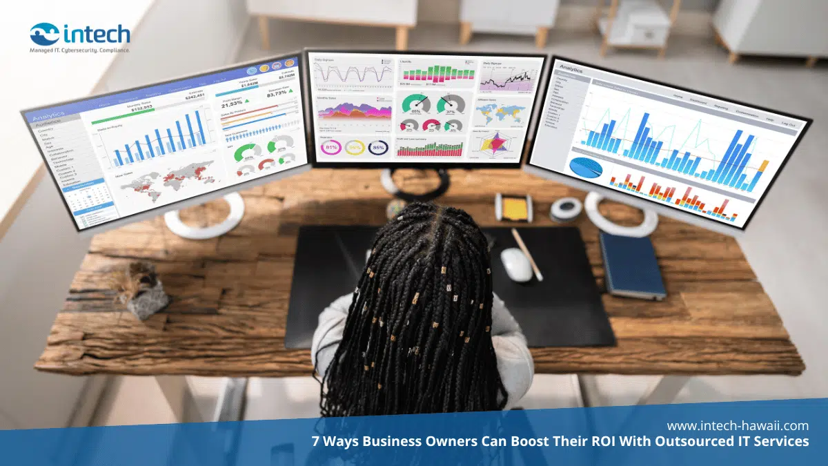 Woman checking analytics on three screens